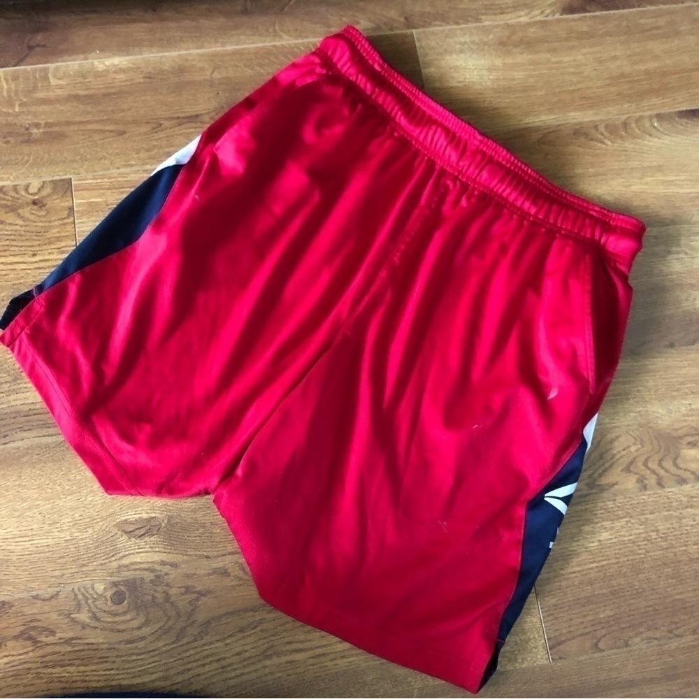 Reebok red athletic shorts in size M
